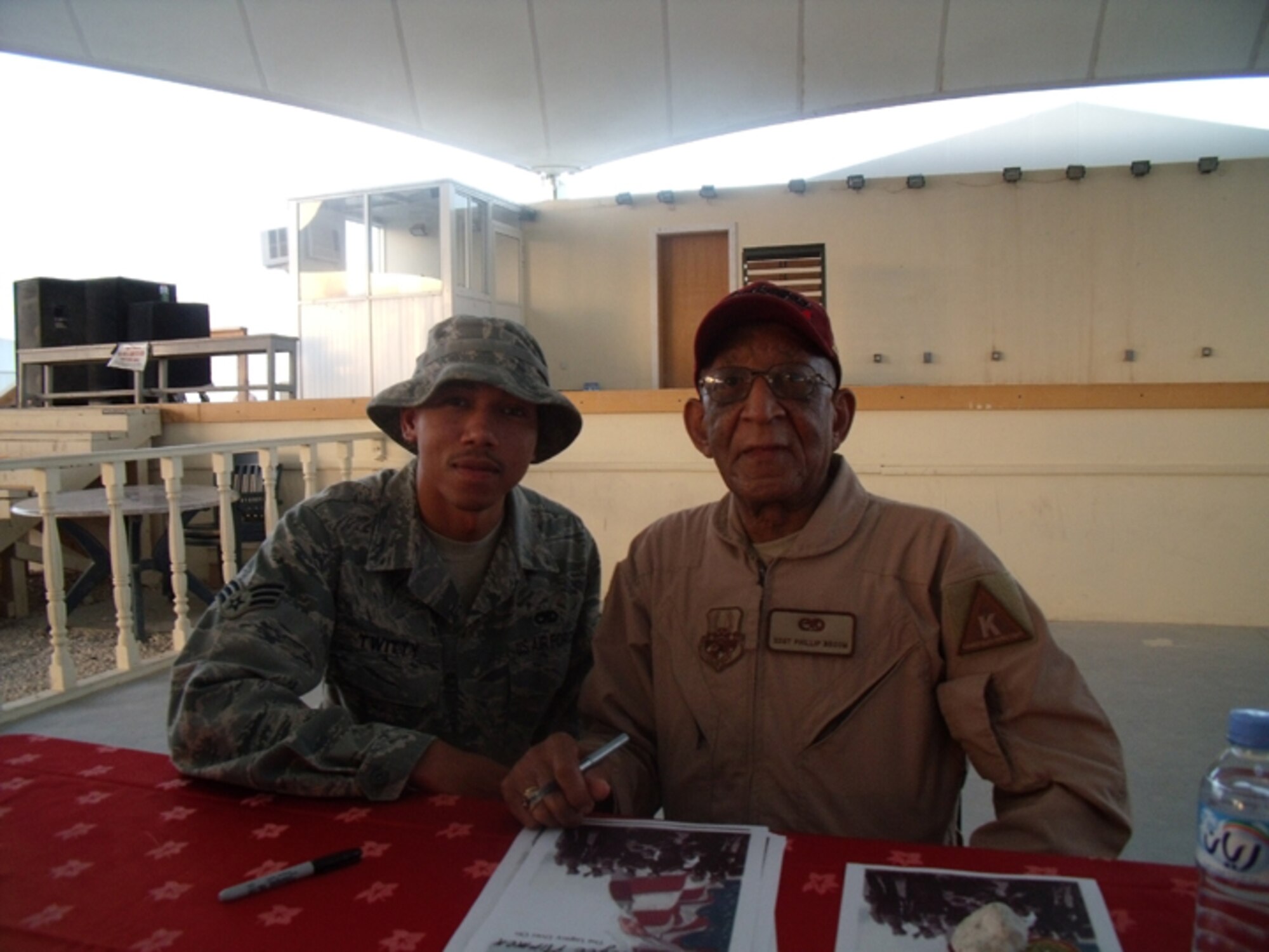 SEYMOUR JOHNSON AIR FORCE BASE, N.C. -- Senior Airman Christopher Twitty and Tuskegee Airman Phillip Broome in Al Udeid.