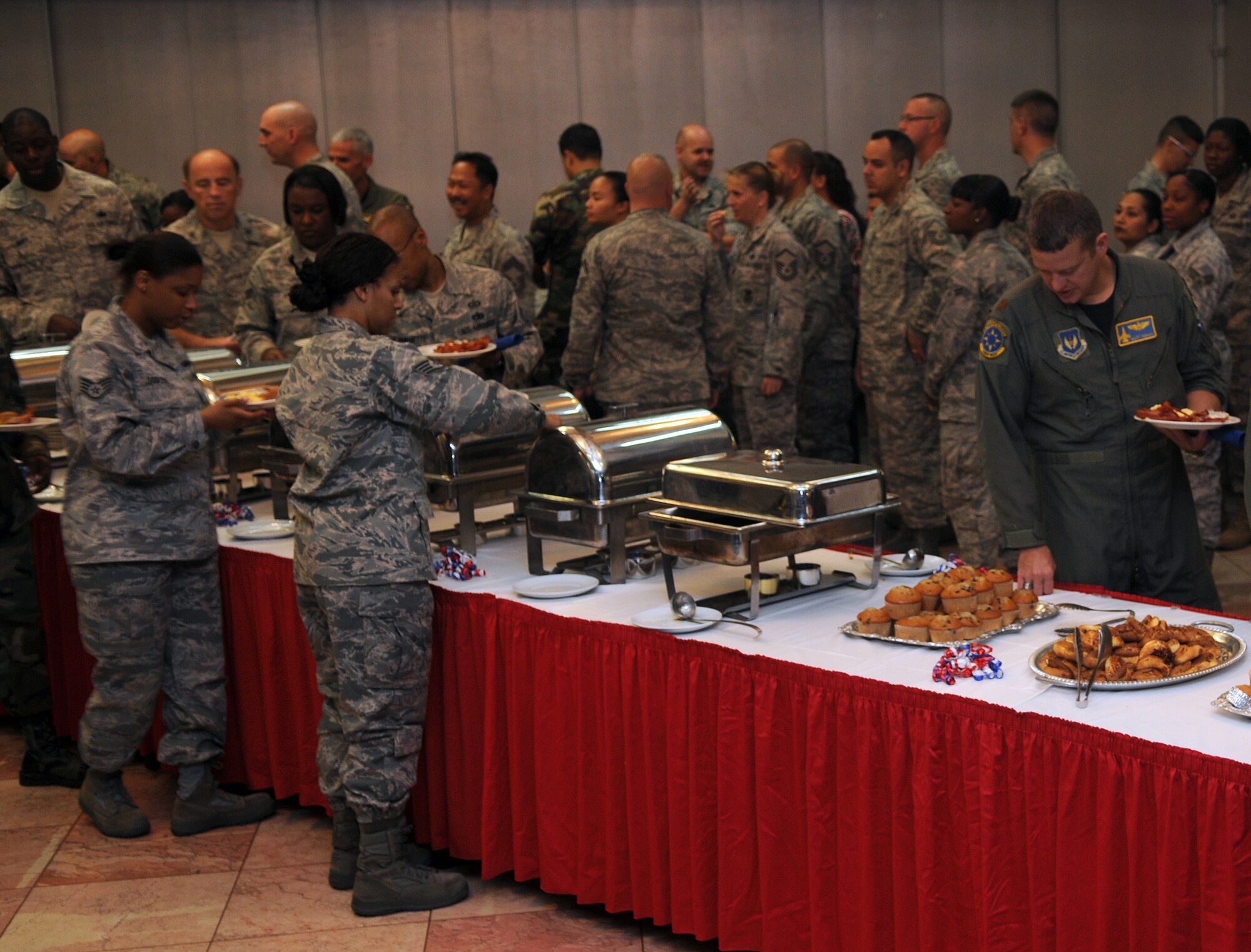 Airmen help themselves to breakfast at the 2009 Combined Federal Campaign Kickoff Breakfast at the club complex Friday, Oct. 2, 2009, at Incirlik Air Base, Turkey. More than 100 Airmen attended the event which raised awareness of the campaign's Oct. 5 start date. The CFC is the only authorized solicitation of Federal employees in their workplaces on behalf of approved charitable organizations. For more information on how to contribute, contact your unit CFC representative or visit www.cfcoverseas.org. (U.S. Air Force photo/Senior Airman Alex Martinez)