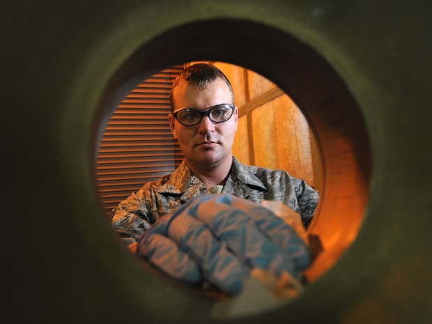 Staff Sgt. Brian Walker, 379th Expeditionary Maintenance Squadron aircraft structural maintenance journeyman, prepares an aircraft wheel to be painted, Oct. 5. The 379 EMXS fabrications flight performs maintenance on external sheet metal, internal framework, composites, fiberglass and plastic, as well as tubing and cable assemblies, on aircraft. Sergeant Walker is deployed from the Tennessee Air National Guard in support of Operations Iraqi and Enduring Freedom. (U.S. Air Force Photo/Tech. Sgt. Jason W. Edwards)