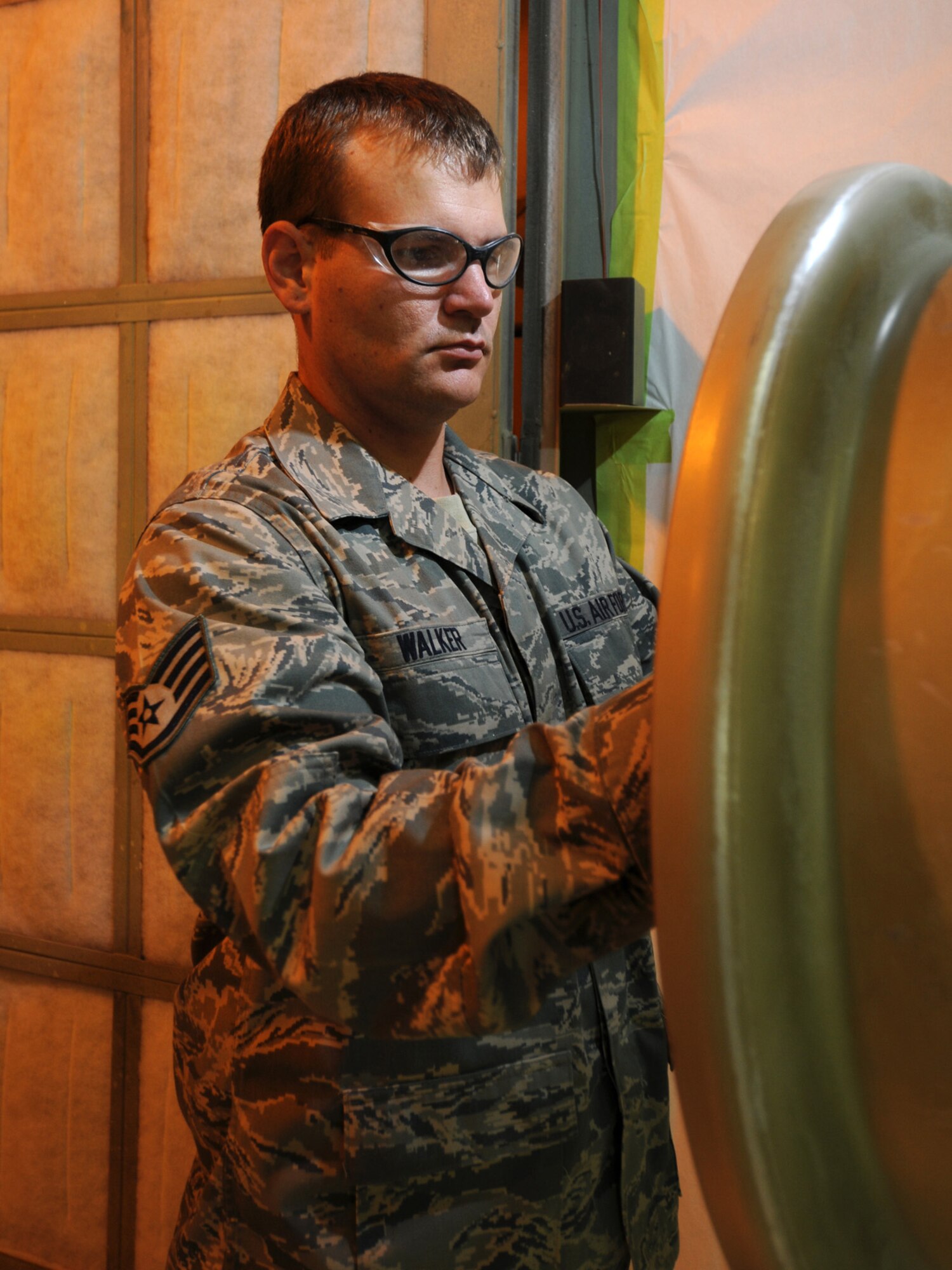 Staff Sgt. Brian Walker, 379th Expeditionary Maintenance Squadron aircraft structural maintenance journeyman, prepares an aircraft wheel to be painted, Oct. 5. The 379 EMXS fabrications flight performs maintenance on external sheet metal, internal framework, composites, fiberglass and plastic, as well as tubing and cable assemblies, on aircraft. Sergeant Walker is deployed from the Tennessee Air National Guard in support of Operations Iraqi and Enduring Freedom. (U.S. Air Force Photo/Tech. Sgt. Jason W. Edwards)