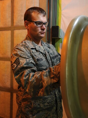 Staff Sgt. Brian Walker, 379th Expeditionary Maintenance Squadron aircraft structural maintenance journeyman, prepares an aircraft wheel to be painted, Oct. 5. The 379 EMXS fabrications flight performs maintenance on external sheet metal, internal framework, composites, fiberglass and plastic, as well as tubing and cable assemblies, on aircraft. Sergeant Walker is deployed from the Tennessee Air National Guard in support of Operations Iraqi and Enduring Freedom. (U.S. Air Force Photo/Tech. Sgt. Jason W. Edwards)