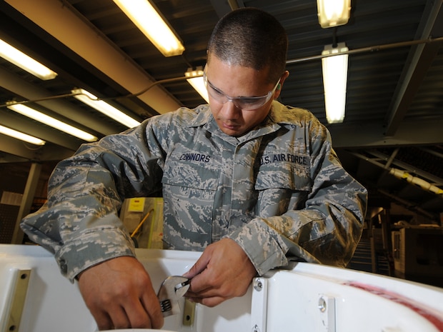 Staff Sgt. Steven Connors, 379th Expeditionary Maintenance Squadron aircraft structural maintenance journeyman, removes screws from an aircraft wheel in preparation for evaluation and repair, Oct. 5. The 379 EMXS fabrications flight performs maintenance on external sheet metal, internal framework, composites, fiberglass and plastic, as well as tubing and cable assemblies, on aircraft. Sergeant Connors is deployed from Keesler Air Force Base, Miss. in support of Operations Iraqi and Enduring Freedom. (U.S. Air Force Photo/Tech. Sgt. Jason W. Edwards)