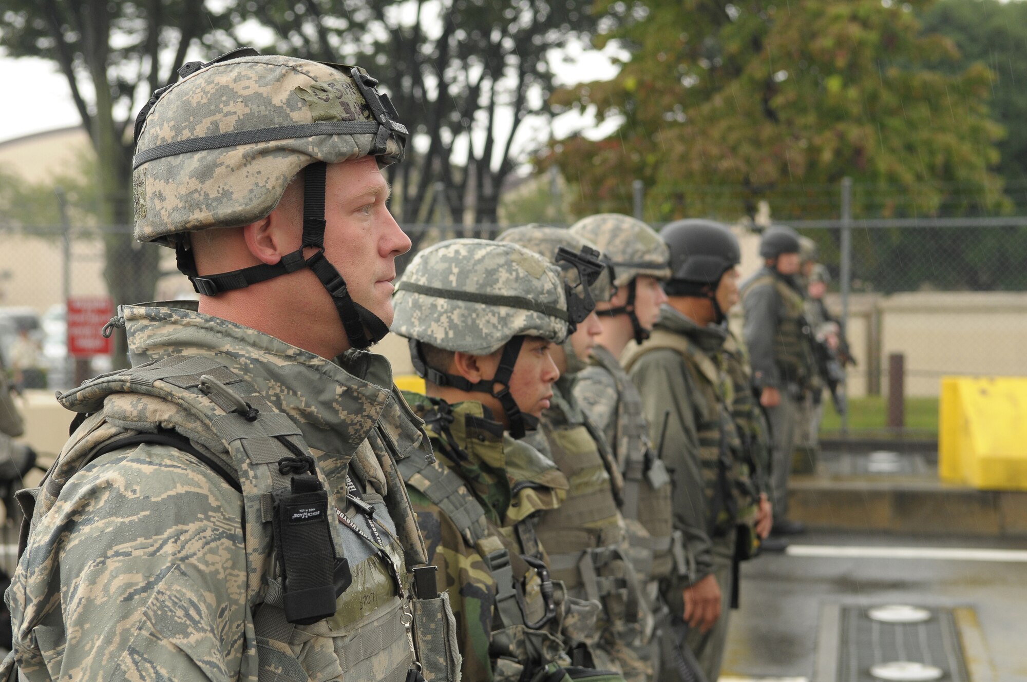 YOKOTA AIR BASE, Japan -- Members of the 374th Security Forces Squadron respond to simulated protestors outside the base's supply gate Oct. 6 during Beverly Bearcat 09-05, an operational readiness inspection conducted by the Pacific Air Forces' Inspector General. (U.S. Air Force photo/Airman 1st Class Sean Martin)