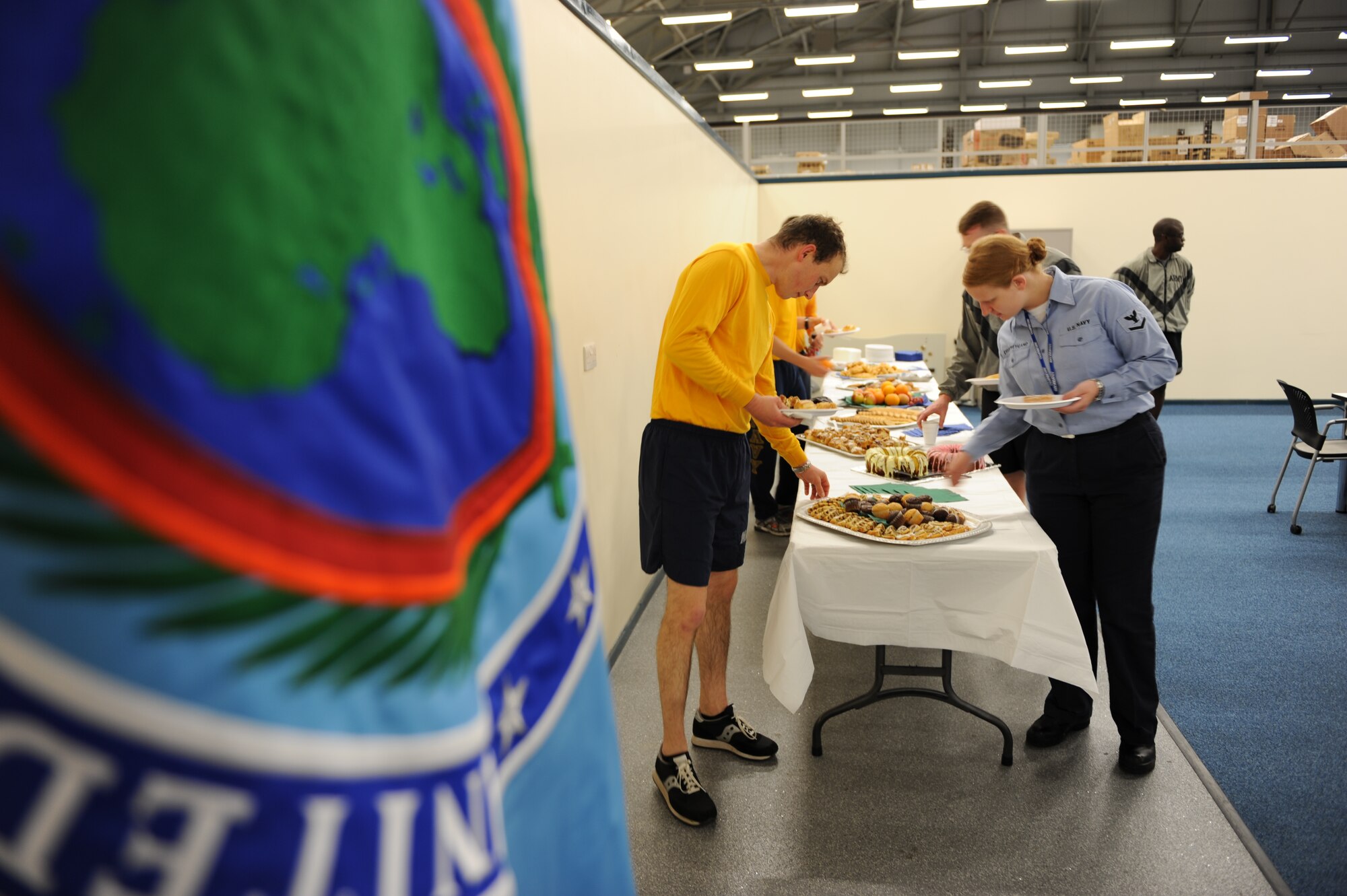 After their four mile run IKD-M team members enjoy breakfast prepared by the IKD-M Spouse’s Club.  (Photo by Mr. Dru Walters)