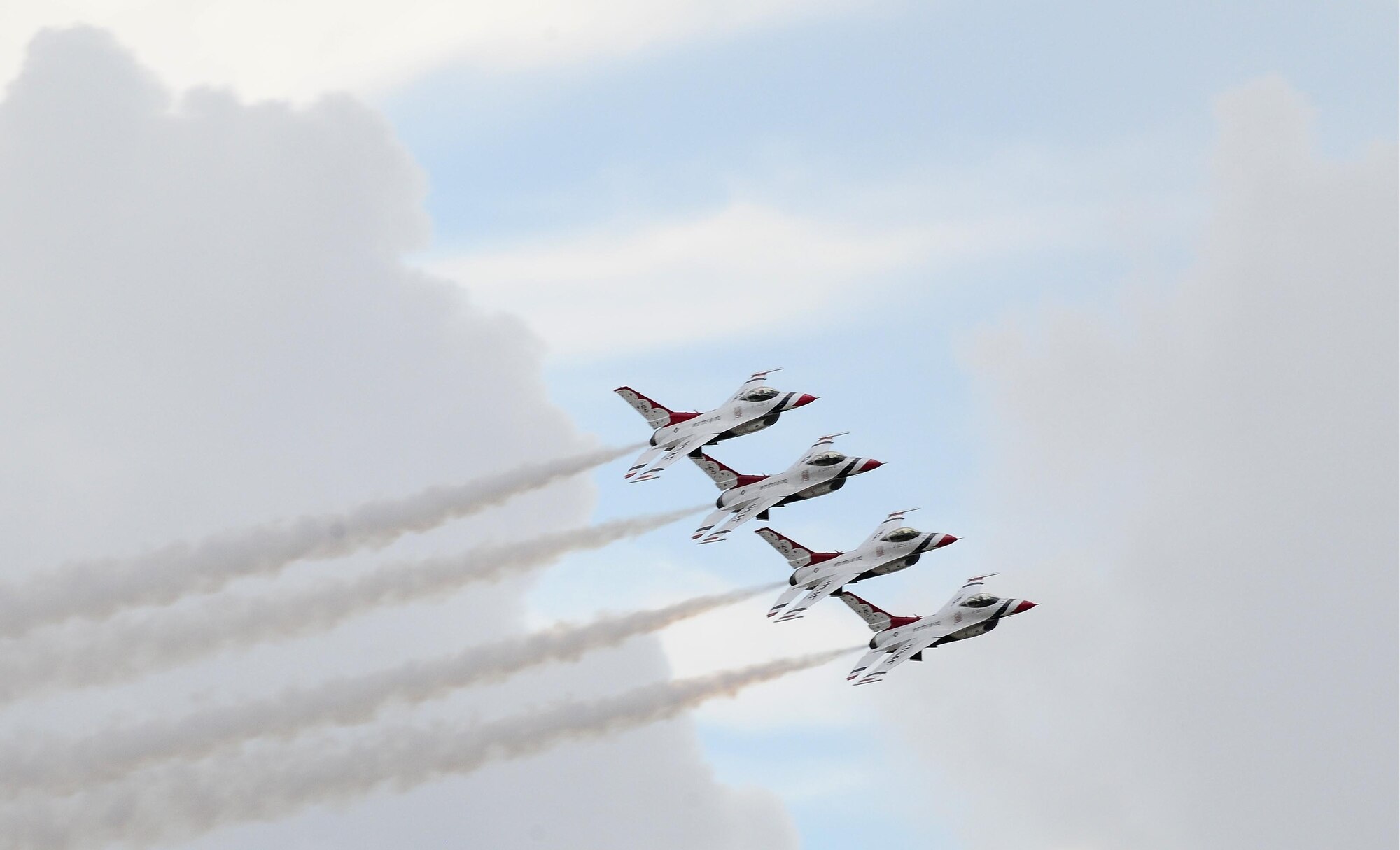 ANDERSEN AIR FORCE BASE, Guam - U.S. Air ForceThunderbird F-16s fly in trail formation here Oct. 6. The air show is a free even open to the public. Andersen's main gate will open at noon and close at 5 p.m. (U.S. Air Force photo by Senior Airman Nichelle Anderson)