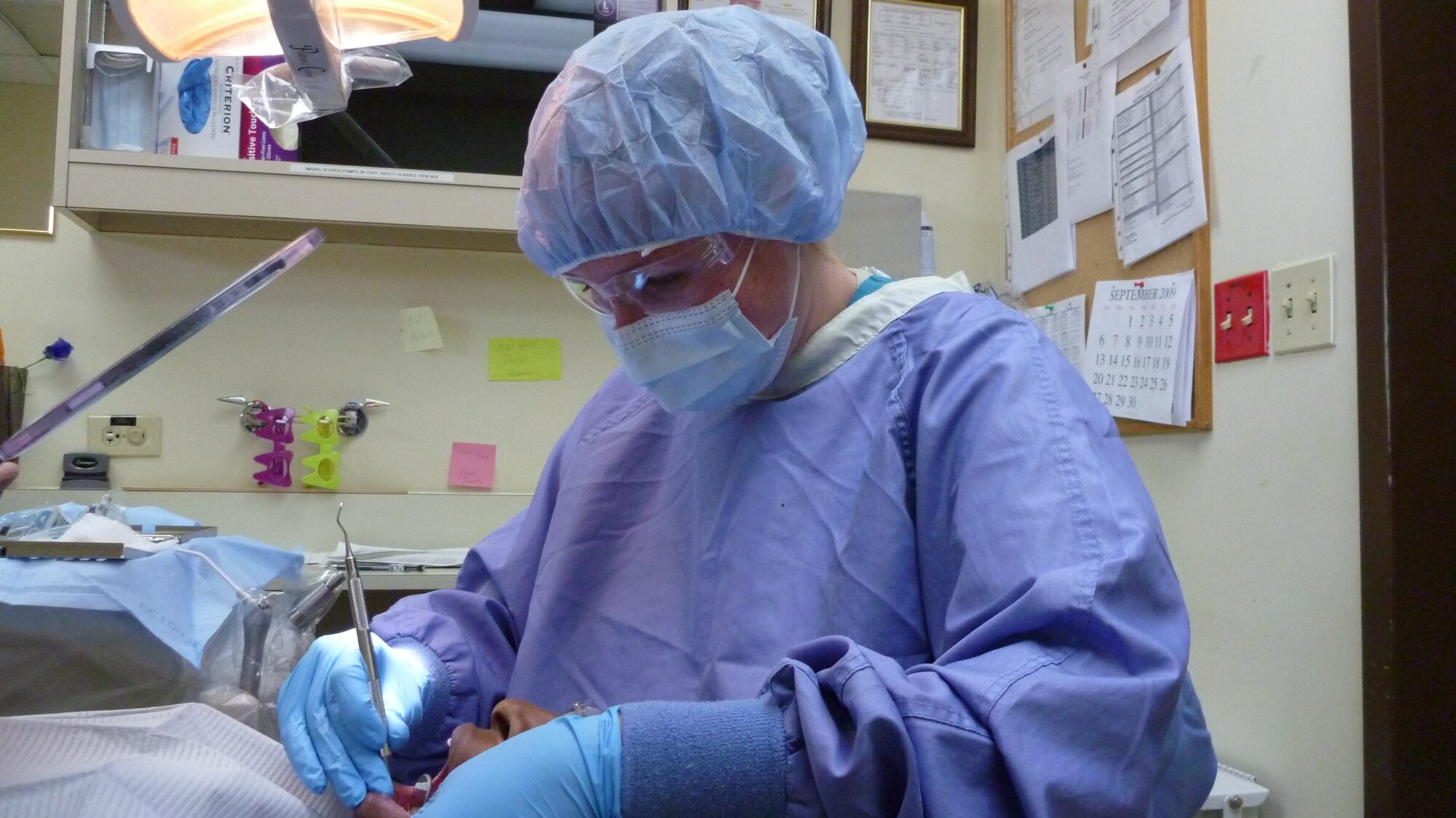 Staff Sgt. Cheyanne Brown of the 51st Dental Squadron works on a patient's teeth.