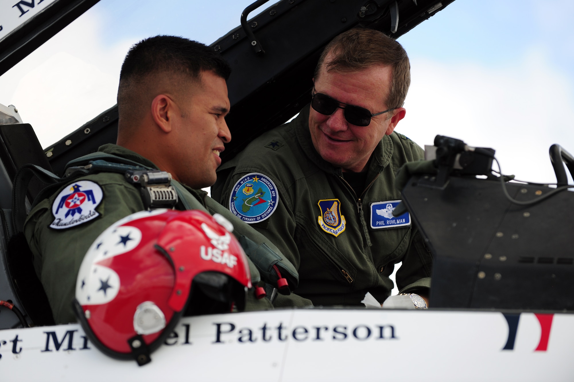 ANDERSEN AIR FORCE BASE, Guam -  Brig. Gen. Phil Ruhlman, 36th Wing commander, thanks Army Sgt. Dan Elliott here Oct. 6 for his service in the Guam Army National Guard and for his heroism during his deployment in Afghanistan May 2008. The Thunderbirds flew Sgt. Elliott in the back seat of an F-16 Falcon over Andersen AFB and the island of Guam. The Thunderbirds are scheduled to perform an airs how over Andersen AFB Oct. 7. (U.S. Air Force photo by Airman 1st Class Courtney Witt)
