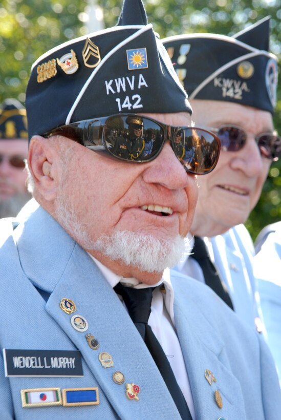 Wendell Murphy, a member of the Korean War Veterans Association, Fredrick, Md., chapter, greets Republic of Korea Brig. Gen. Kim Kook-Hwan during a wreath-laying ceremony at the Korean War Veterans Memorial in Washington, D.C., Oct. 5, 2009. Murphy was a member of the color guard for the ceremony.