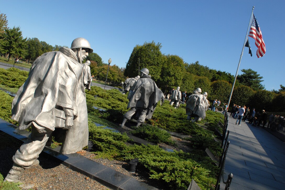 The Korean War Veterans Memorial depicts a formation of 19 statues of servicemembers maneuvering across a rough terrain of juniper bushes and symbolizes the heroics troops displayed in the Korean War. Several active duty servicemembers, Republic of Korea delegates and U.S. veterans of that war were on hand for a wreath-laying ceremony at the memorial in Washington, D.C., Oct. 5, 2009.