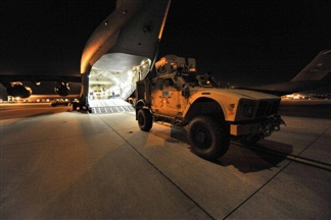 A mine-resistant, ambush-protected all-terrain vehicle (MATV) is loaded onto a U.S. Air Force C-17 Globemaster III aircraft on Sept. 30, 2009.  The C-17, based at McChord Air Force Base, Wash., will take on a second vehicle then fly the cargo to southwest Asia to support combat missions.  