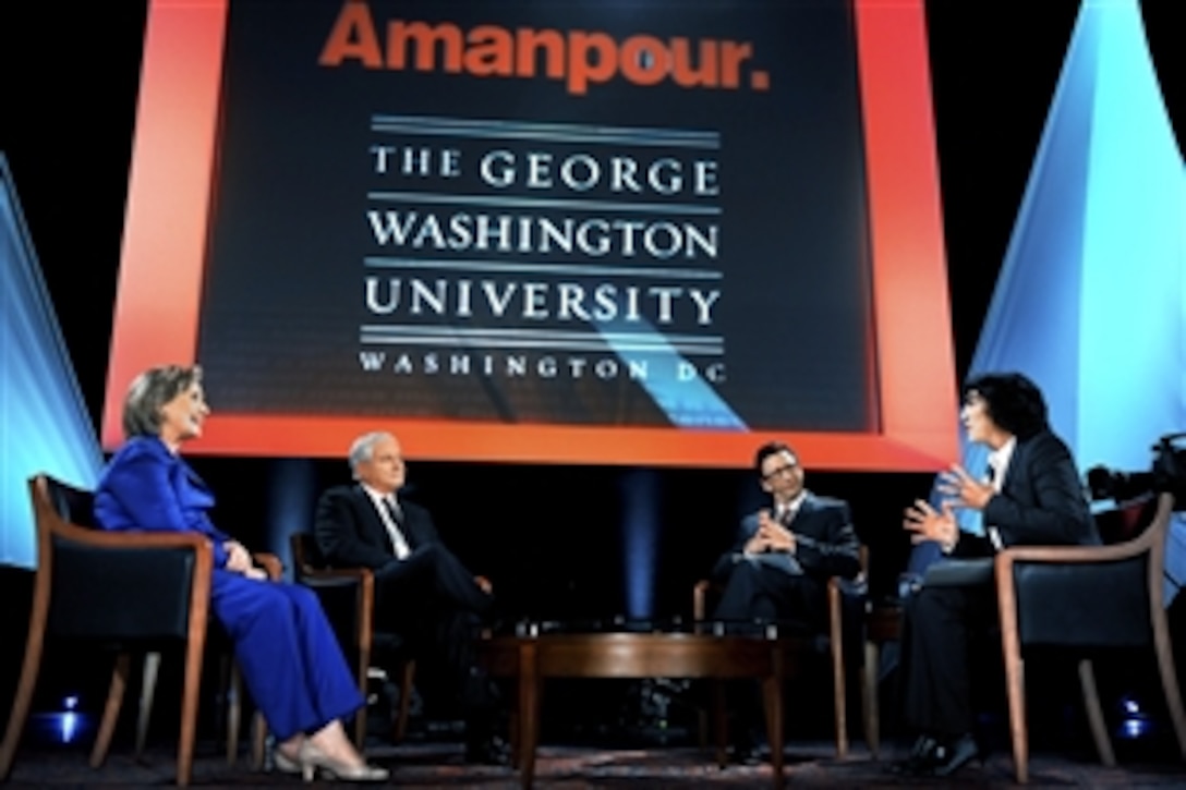 Secretary of State Hillary Rodham Clinton, left, and Defense Secretary Robert M. Gates respond to questions from Frank Sesno, George Washington University School of Media and Public Affairs director, second left, and CNN Chief International Correspondent Christiane Amanpour, right, at George Washington University in Washington, D.C., Oct. 5, 2009. 