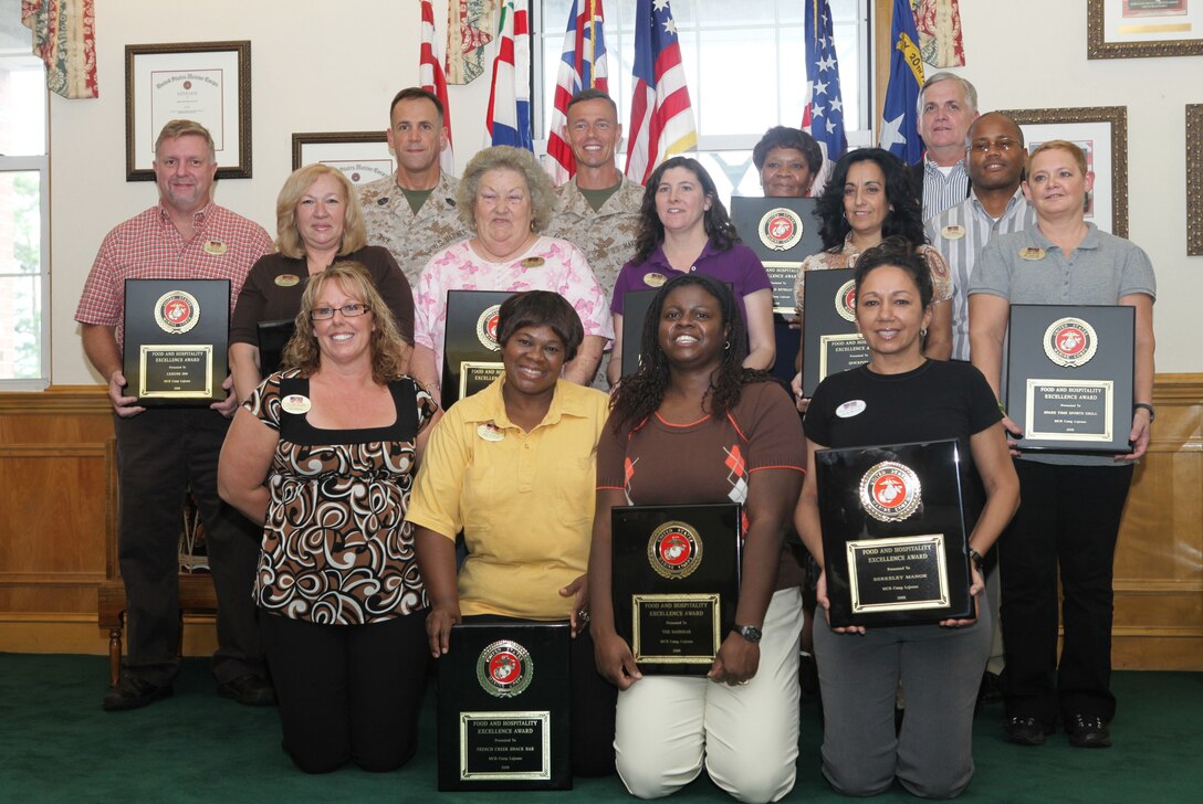 Two things are of high importance to Marines… their pay and food. Marine Corps Community Services aboard Marine Corps Base Camp Lejeune knows just how to satisfy its service member’s tummies. Recently the commanding officer for Marine Corps Base Camp Lejeune, Col. Richard P. Flatau Jr. presented several Food and Hospitality Excellence Awards for Fiscal Year 2008 to the Food and Hospitality Division with MCCS. Ten employees received the awards, on behalf of 4 Corners, Berkeley Manor, Duffers Retreat, French Creek Snack Bar, Grammy’s, Quickfuel, Spare Time Sport Grill, The Filling Station, The Sandbar and Lejeune Inn aboard the base.