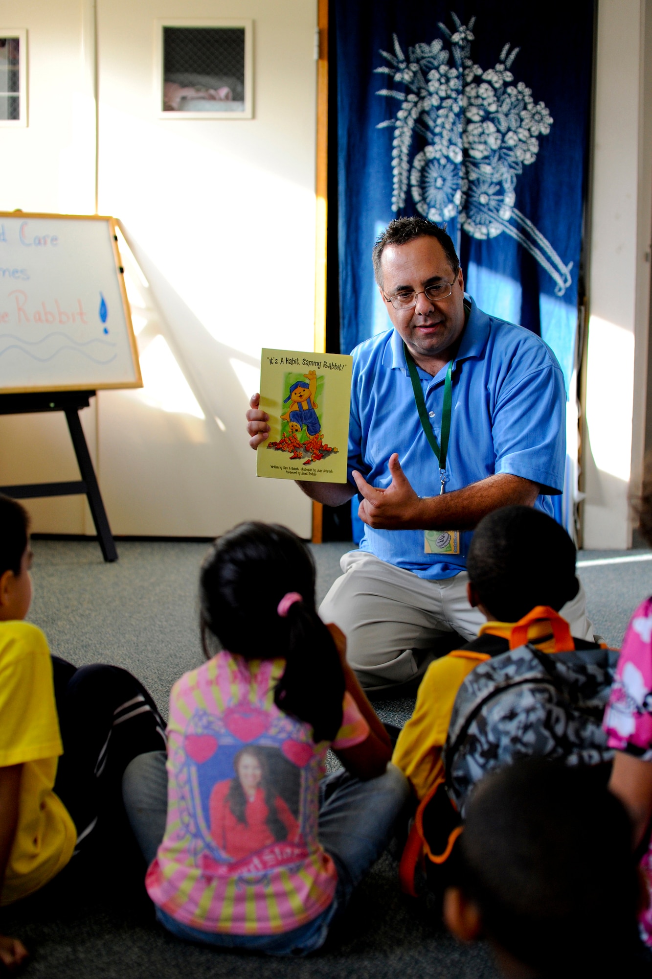 MISAWA AIR BASE, Japan -- Sam Renick, author of "It's a Habit, Sammy Rabbit!" introduces his book Oct. 7 at the Family Child Care Center. Mr. Renick also made trips to Sollars and Cummings Elementary Schools in an effort to teach children the importance of saving money. (U.S. Air Force photo/Senior Airman Jamal D. Sutter)