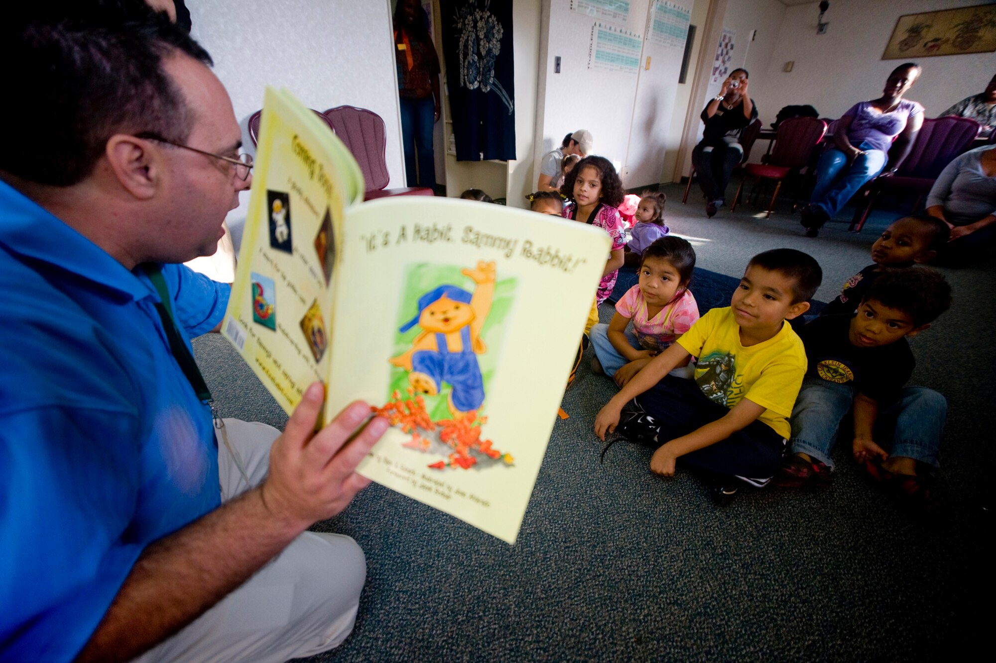 MISAWA AIR BASE, Japan -- Sam Renick, author of "It's a Habit, Sammy Rabbit!" reads his book to Misawa Air Base children Oct. 7 at the Family Child Care Center. The story's focus was to encourage kids to save money. (U.S. Air Force photo/Senior Airman Jamal D. Sutter)
