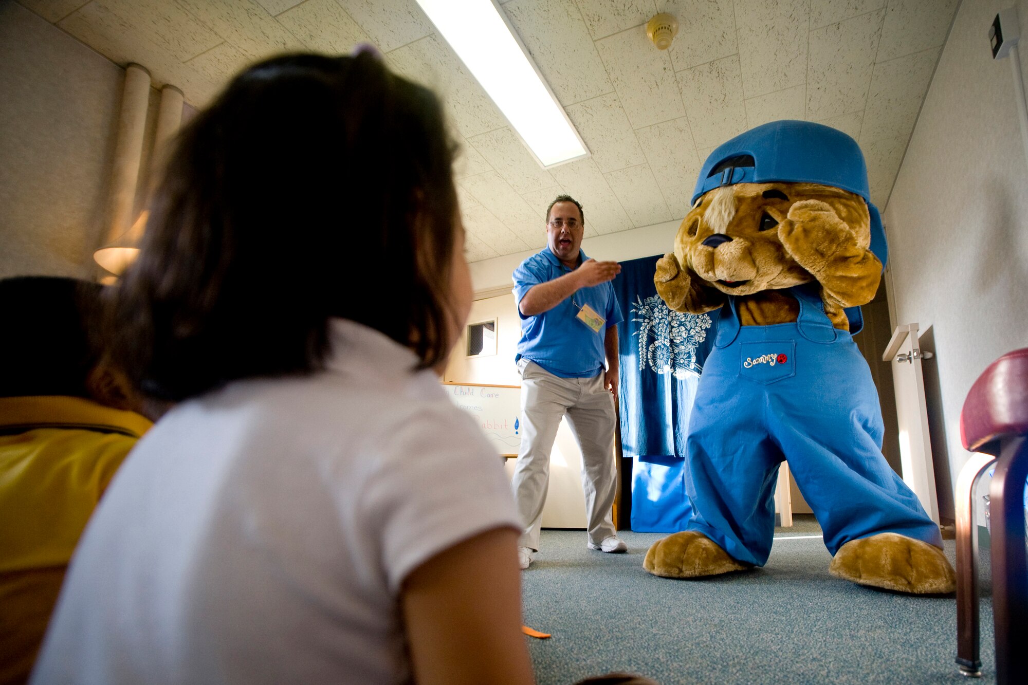MISAWA AIR BASE, Japan -- Sam Renick, author of "It's a Habit, Sammy Rabbit!" introduces Sammy Rabbit Oct. 7 at the Family Child Care Center. Children were able to sing and dance with Sammy Rabbit and also received CDs of songs that promoted good habits. (U.S. Air Force photo/Senior Airman Jamal D. Sutter)