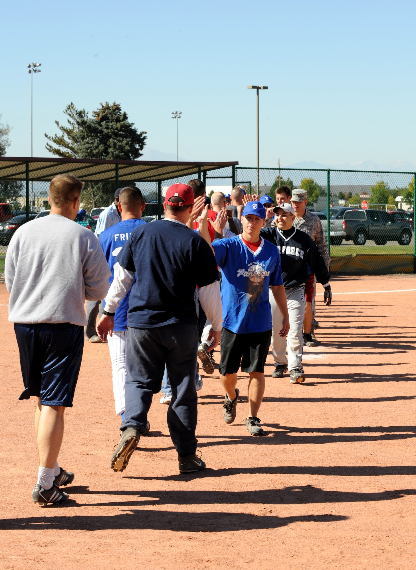 Buckley Air Force Base, Colo. – The 460th Buckley Panthers and the Top 3/Commanders shake hands after a softball game during Buckley’s Sports and Field Day Oct. 2. The Panthers beat the Top 3/Commanders team 13-8. (U. S. Air Force photo by Senior Airman John Easterling)