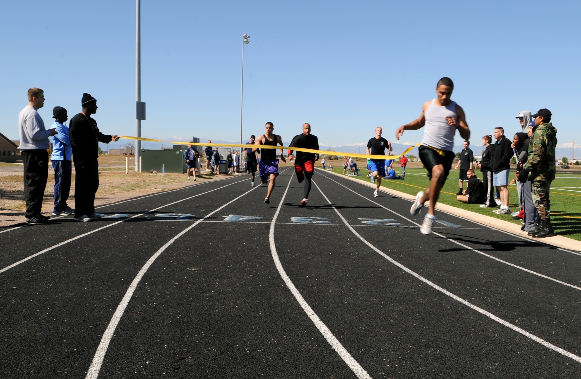 Buckley Air Force Base, Colo. – Anthony Simmons, 566 Intelligence Squadron, wins the 100-yard dash during Buckley's Sports and Field Day Oct. 2. Simmons won with a time of 11.79 seconds. (U.S. Air Force photo by Senior Airman Erika Brooke)