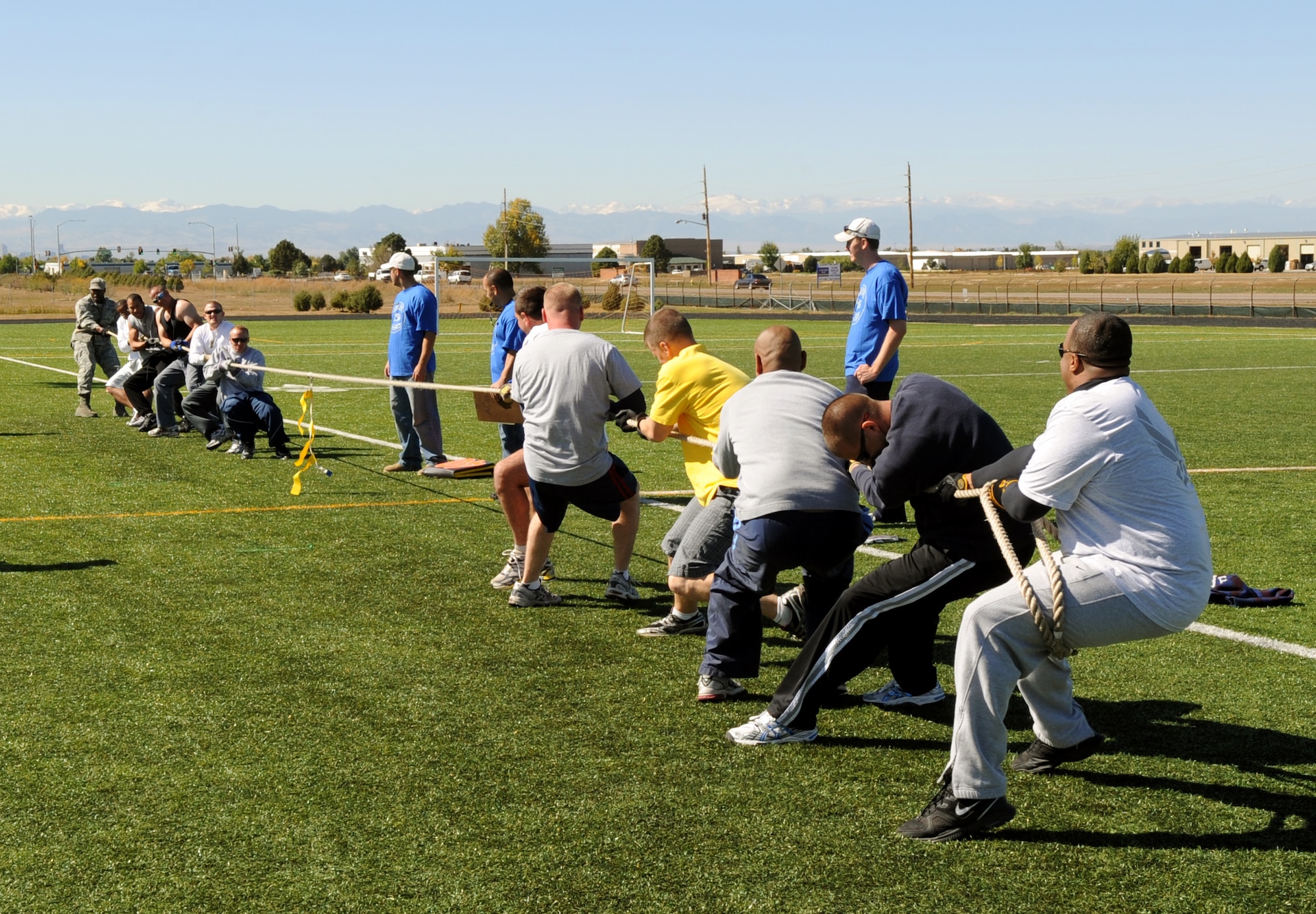Buckley Air Force Base, Colo. – The 460th Civil Engineer Squadrons pulls Detachment 6 across the line during a tug of war game during Buckley’s Sports and Field Day Oct. 2. (U. S. Air Force photo by Senior Airman John Easterling)