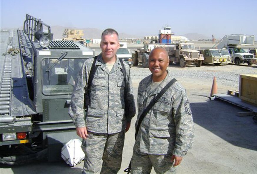 KANDAHAR, Afganhistan- Senior Master Sgt. Mike Mendoza (right), 86th Aerial Port Squadron, McChord Air Force Base, Wash., meets Lt. Col. Randy Stoeckman, Air Force Forces Deputy Air Reserve Component Advisor while deployed. Colonel Stoeckman says of Sergeant Mendoza, "I heard nothing but great comments about the job he is doing; seamless actions and an infectious, positive attitude. He supported our trip ... and I cannot say enough about his work ethic. A real hard-charger.  Senior Master Sergeant Mendoz represented the 446th with the utmost of pride and professionalism." (Courtesy photo)                               