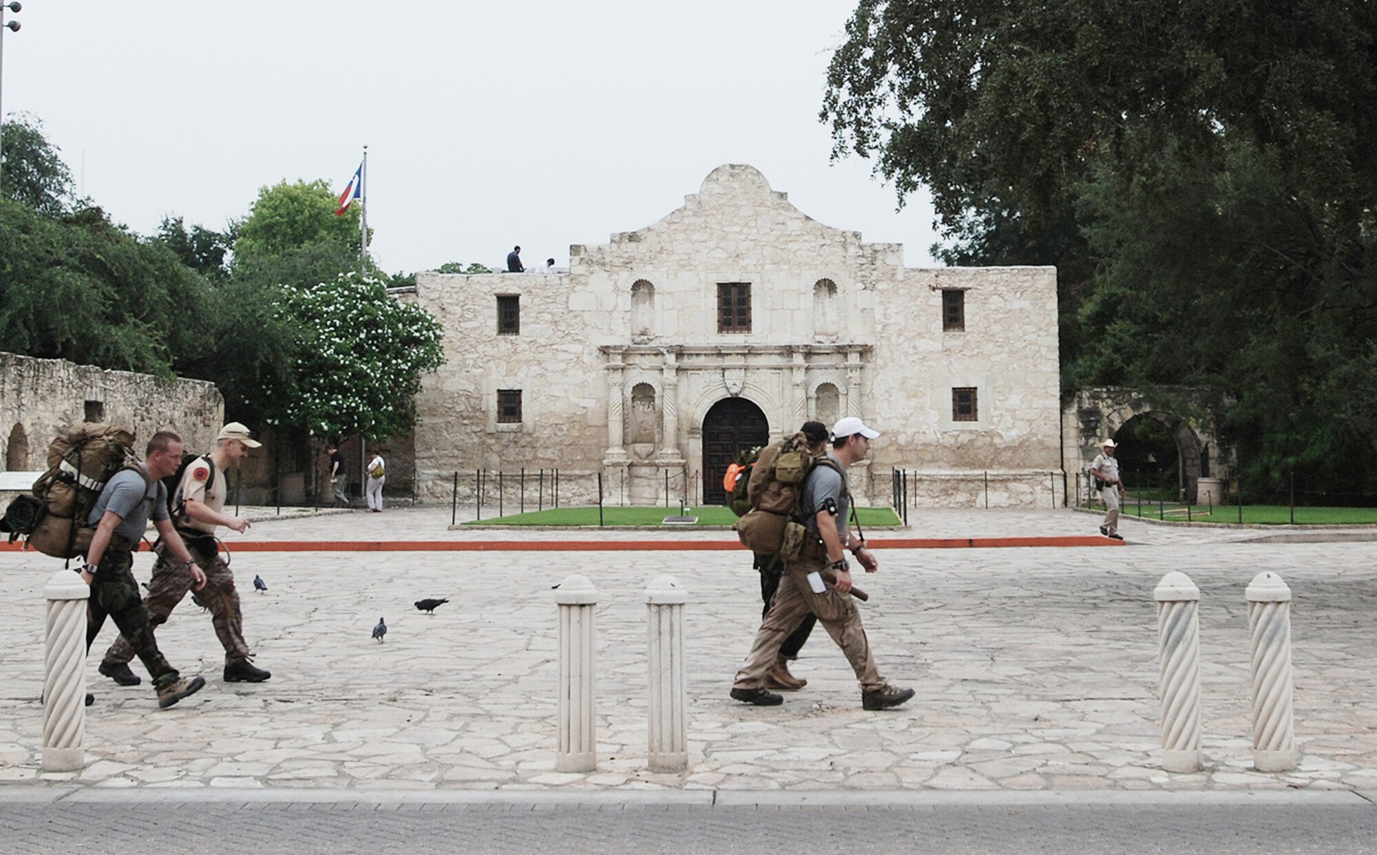 Air Force combat controllers pass through downtown San Antonio as they march more than 800 miles from Lackland Air Force Base, Texas, to Hurlburt Field, Fla., in 11 days. They are marching to honor 12 special tactics Airmen who died in Iraq and Afghanistan. (U.S. Air Force photo/Airman 1st Class Brian McGloin) 