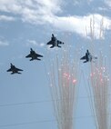 F-15C 'Eagles' roar over Invesco Field Oct. 4 during the pre-game national anthem before the Denver Broncos-Dallas Cowboys NFL game in Denver. The F-15s, assigned to the Oregon Air National Guard's 173rd Fighter Wing, were directly followed by a mass enlistment of citizens into the Air Force Reserve, hosted by both the 310th Space Wing and 302nd Airlift Wing, both based in Colorado Springs, Colo. The 173rd FW is based at Klamath Falls, Ore. (U.S. Air Force photo/Tech. Sgt. Daniel Butterfield)