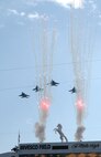 F-15C 'Eagles' roar over Invesco Field Oct. 4 during the pre-game national anthem before the Denver Broncos-Dallas Cowboys NFL game in Denver. The F-15s, assigned to the Oregon Air National Guard's 173rd Fighter Wing, were directly followed by a mass enlistment of citizens into the Air Force Reserve, hosted by both the 310th Space Wing and 302nd Airlift Wing, both based in Colorado Springs, Colo. The 173rd FW is based at Klamath Falls, Ore. (U.S. Air Force photo/Tech. Sgt. Daniel Butterfield)