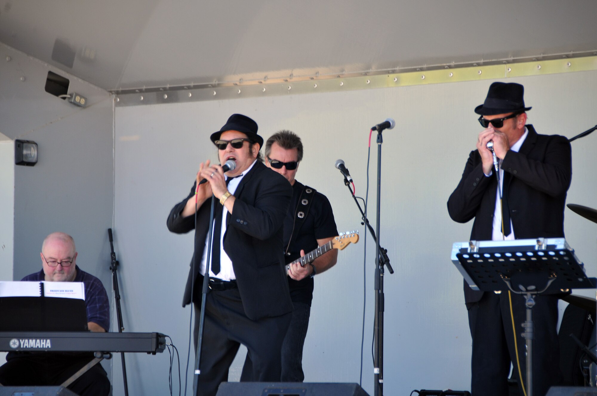 ALTUS AIR FORCE BASE, Okla. -- A Blues Brothers tribute band entertains the crowd during the 4th Annual Operation Welcome Home Sept. 26 in the Freedom Community Center parking lot. The event consisted of a buffet, live music, games and other activities held in honor of Airmen, who have returned from deployment in the past year, and their families. (U.S. Air Force photo/Senior Airman Jennifer Flores)
