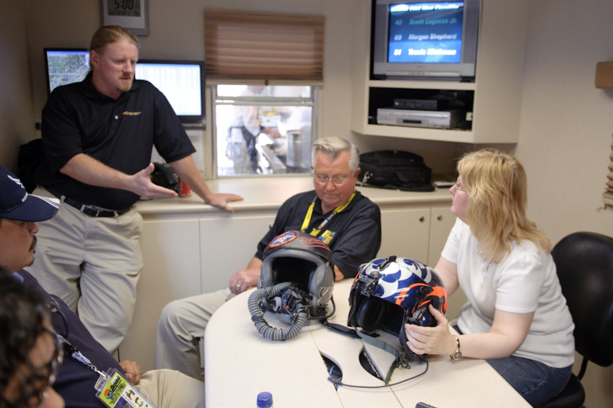 Government and SPEAR Labs officials met at Bristol Motor Speedway to discuss hearing protection and communications technology that was successfully developed for the Warfighter to determine if it can work for NASCAR drivers who also operate in extremely noisy conditions. From left are Augustine Vu (seated), Air Force Small Business Innovation Research (SBIR) program manager; Mr. Dale Lott, president of SPEAR Labs; Mr. John Thornton, co-owner of SPEAR Labs; and Ms. Cynthia Gonsalves, director, Office of the Secretary of Defense/Office of Technology Transition (OSD/OTT). (Photo submitted)