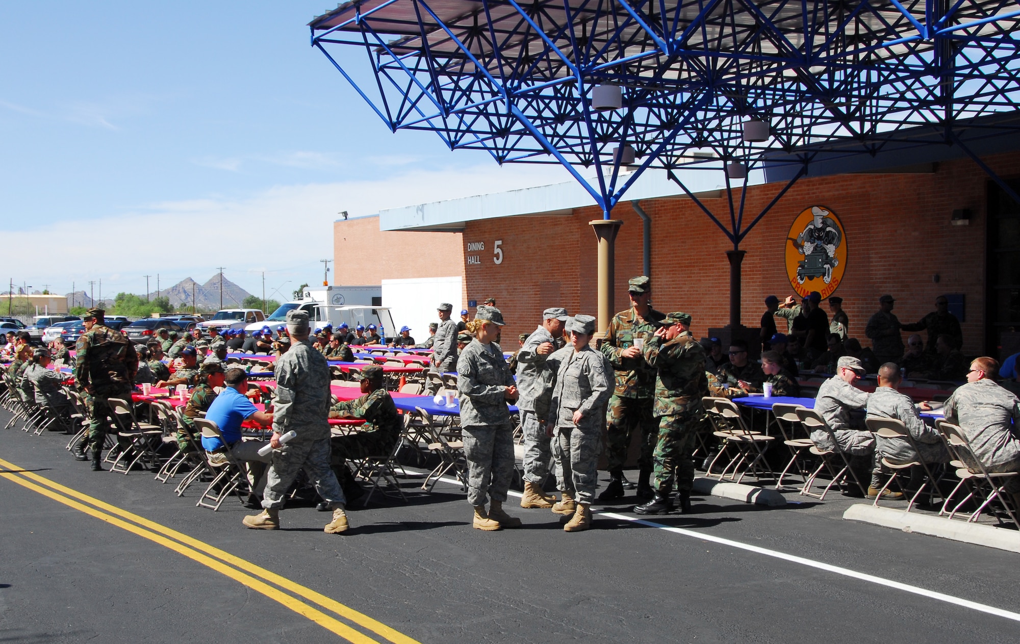 Airmen from 162nd Fighter Wing and 214th Reconnaissance Group enjoy a Sunday afternoon at the 2009 Steak Fry in front of the 162nd's dining facility at Tucson International Airport Oct. 4. (Air National Guard photo by Master Sgt. Dave Neve)