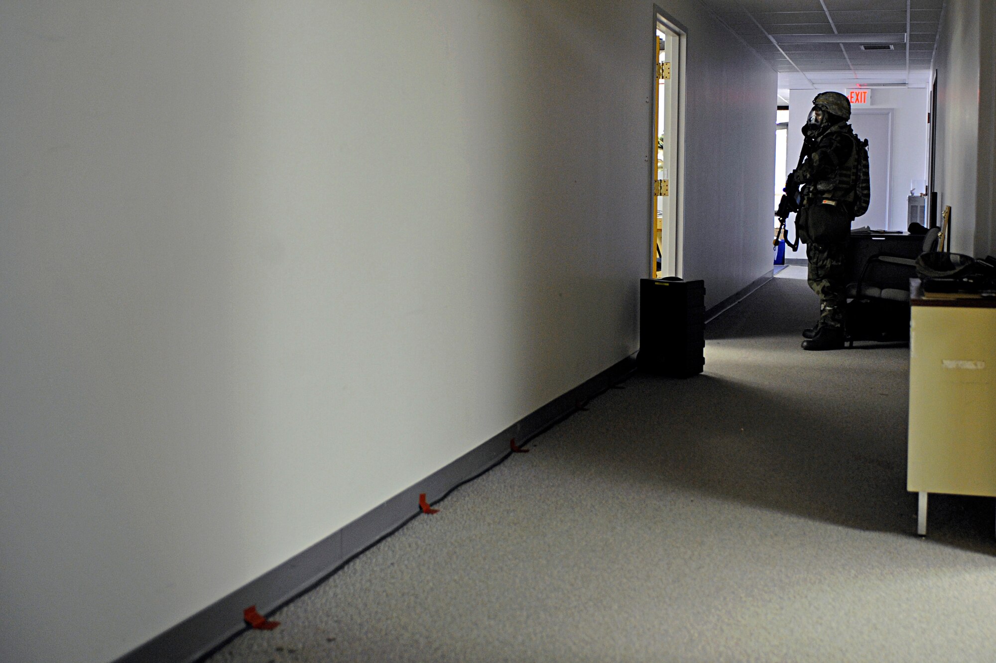 Senior Airman Isaac Bliek, 28th Security Forces Squadron patrolman, stands guard at the entry control point during a Phase II Operational Readiness Exercise here, October 7. The exercise is designed to test Airmen’s knowledge about what to do in a deployed environment. (U.S. Air Force photo/Airman 1st Class Matthew Flynn)