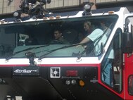 MINOT AIR FORCE BASE, N.D. -- Airman 1st Class Eric Flores, 5th Civil Engineer Squadron firefighter, shows STARBASE students the interior workings of a fire truck here recently. (Courtesy photo)