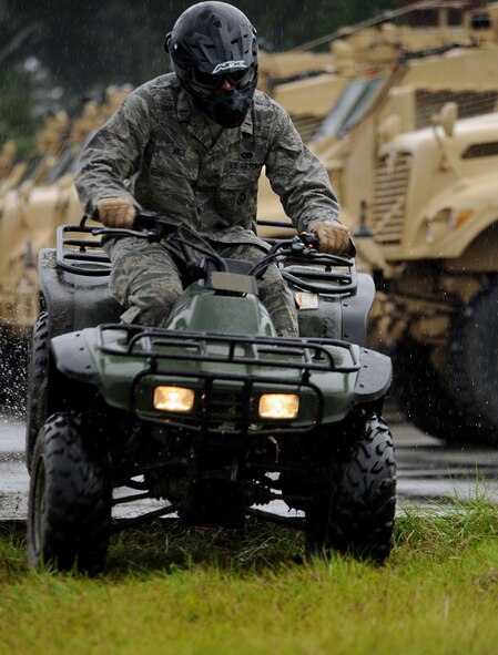 MOODY AIR FORCE BASE, Ga. -- 2nd Lt. Nathan Aiken, 823rd Security Forces Squadron bravo flight commander, jumps his all-terrain vehicle over a log during a training course here Oct. 5. This scenario required participants to jump their vehicle over obstacles while still maintaining balance on their ATV as well as control. (U.S. Air Force photo by Airman 1st Class Joshua Green)
 
