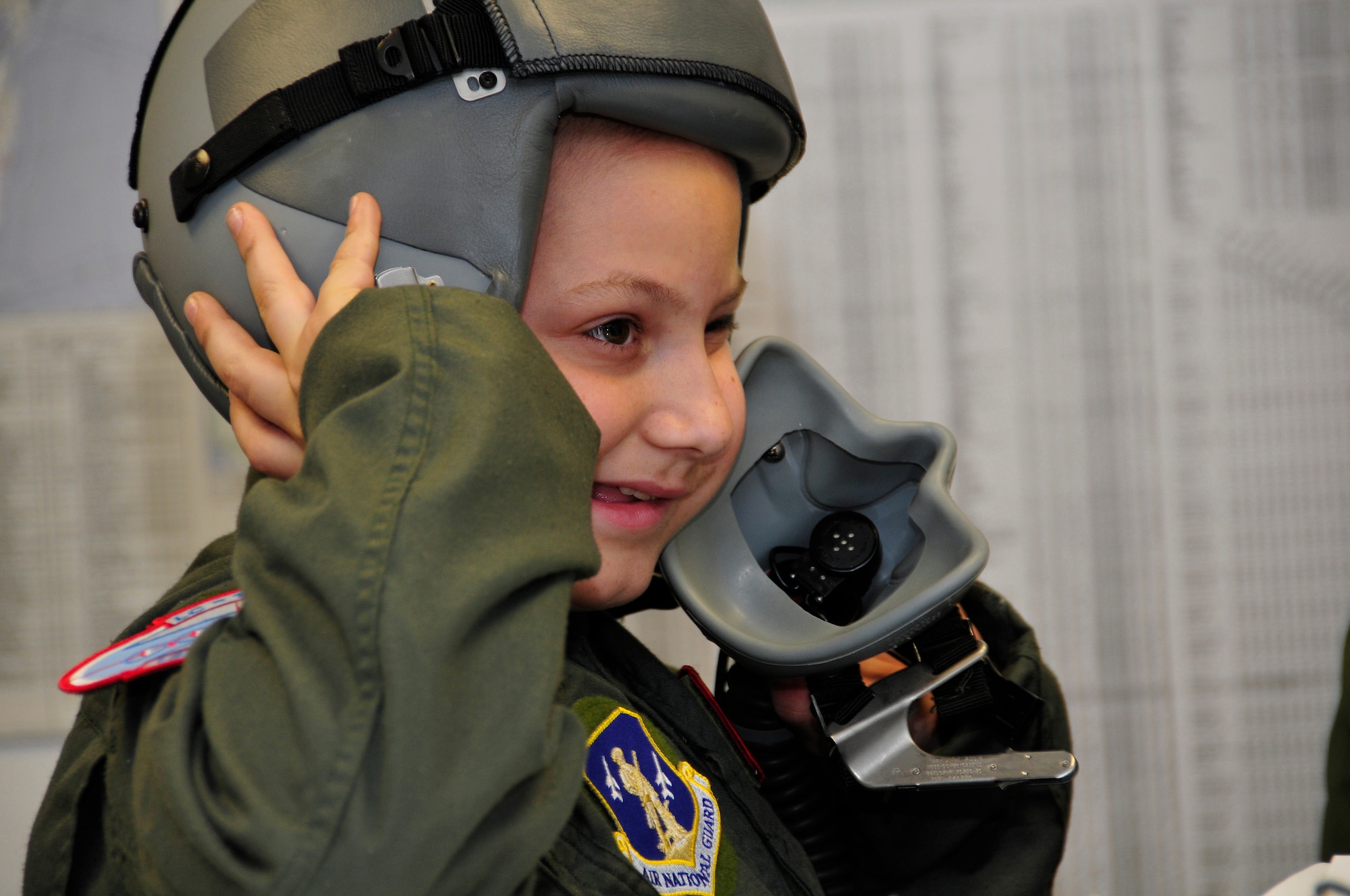 Jacob Kaminski puts on his aircrew gear before his mock LC-130 mission. Jacob, 9, came to the base Oct. 6 to fulfill his dream of being a soldier for a day. After spending the day with the Army, he came to the base to see what it was like to be a pilot with the 109th Airlift Wing. Jacob has been diagnosed with leukemia. (U.S. Air Force photo by Master Sgt. Willie Gizara)