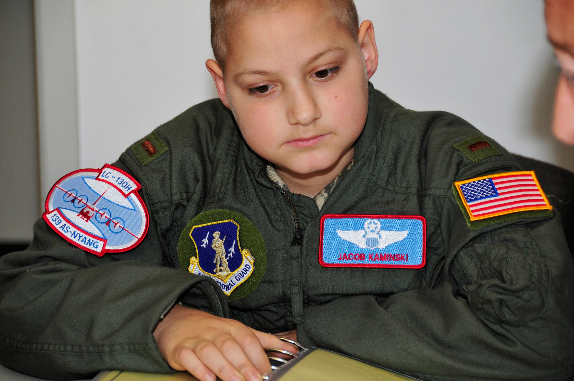 Jacob Kaminski sits in on the flight brief before his mock LC-130 mission. Jacob, 9, came to the base Oct. 6 to fulfill his dream of being a soldier for a day. After spending the day with the Army, he came to the base to see what it was like to be a pilot with the 109th Airlift Wing. Jacob has been diagnosed with leukemia. (U.S. Air Force photo by Master Sgt. Willie Gizara)