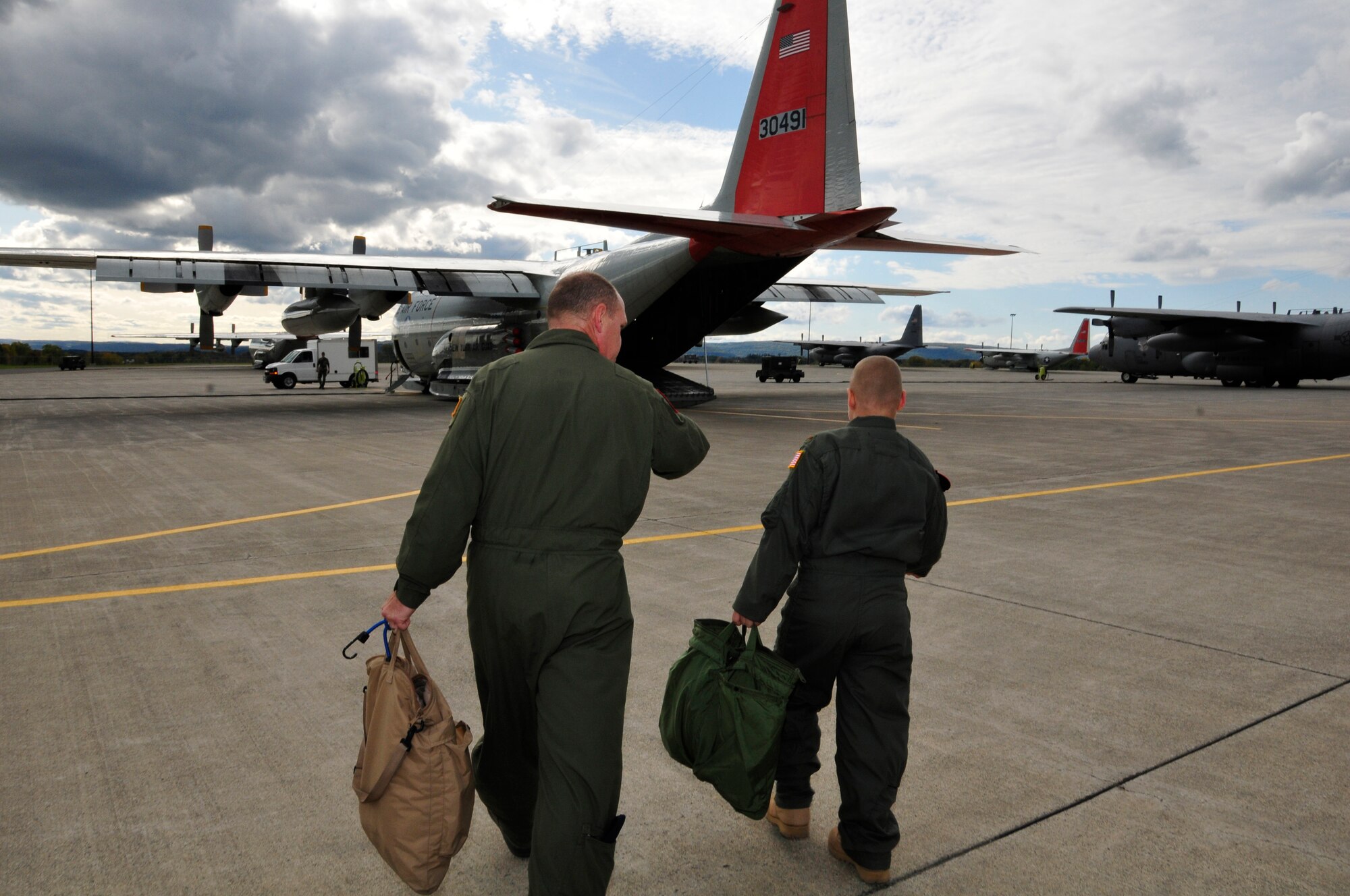 Chief Master Sgt. Don Morrell walks Jacob Kaminski to an LC-130 Hercules for a mock mission. Jacob, 9, came to the base Oct. 6 to fulfill his dream of being a soldier for a day. After spending the day with the Army, he came to the base to see what it was like to be a pilot with the 109th Airlift Wing. Jacob has been diagnosed with leukemia. (U.S. Air Force photo by Master Sgt. Willie Gizara)