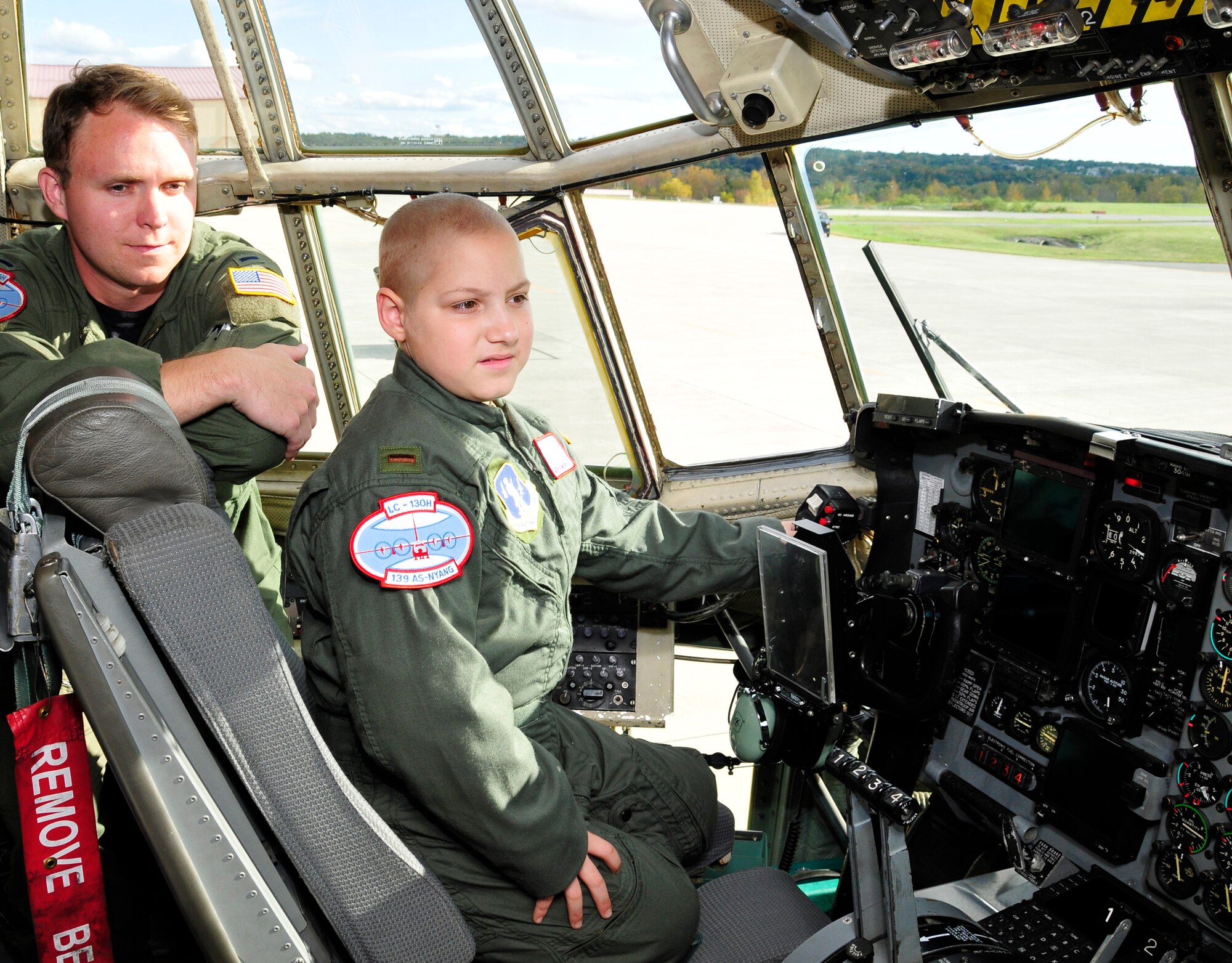Jacob Kaminski sits in the cockpit of an LC-130 Hercules. Jacob, 9, came to the base Oct. 6 to fulfill his dream of being a soldier for a day. After spending the day with the Army, he came to the base to see what it was like to be a pilot with the 109th Airlift Wing. Jacob has been diagnosed with leukemia. (U.S. Air Force photo by Master Sgt. Willie Gizara)