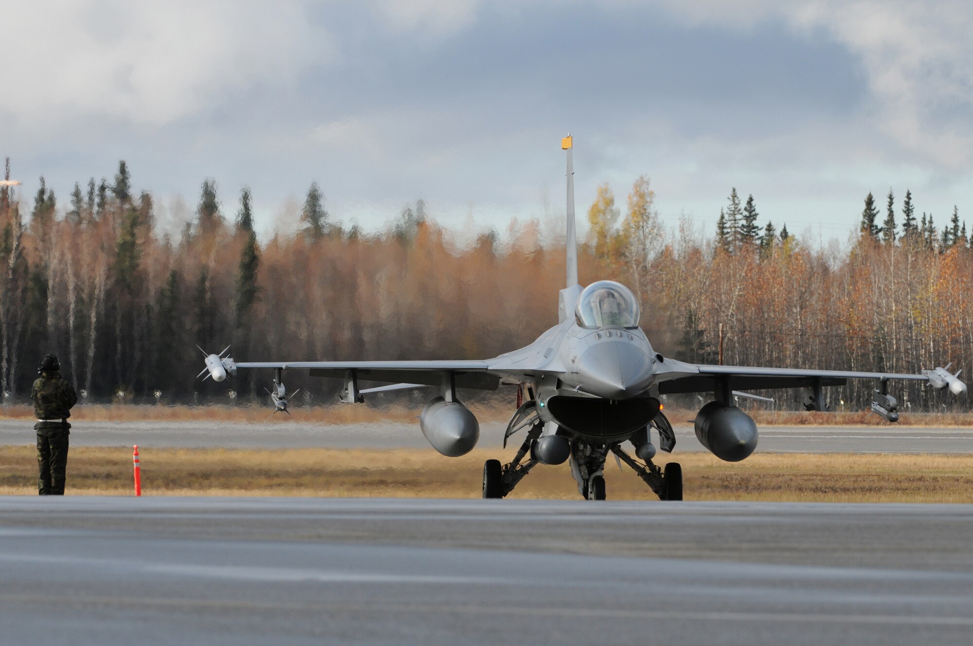 An F-16 Fighting Falcon from Misawa Air Base, Japan, goes over final flight checks prior to take off during RED FLAG-Alaska 10-1 Oct. 6, 2009, Eielson Air Force Base, Alaska. RF-A provides U.S. and allied pilots, aircrews and operational support personnel the opportunity to train and improve their air combat skills in preparation for a myriad of worldwide contingencies. (U.S. Air Force photo/Staff Sgt. Christopher Boitz)  
