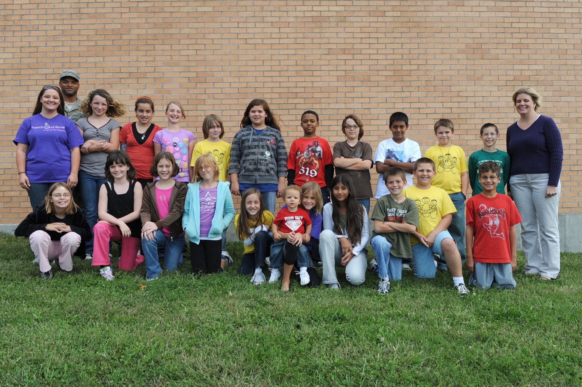 WHITEMAN AIR FORCE BASE, Mo. - Mrs. Ortiz's 5th grade class poses for a photo with the Mahaney Family after winning the most amount raised in their class in support of March For Dimes, Oct 6. Mrs. Ortiz's class helped raise $178.82 in support of March of Dimes earning them a pizza party for their class. Overall, Whiteman Elementary School Raised $947.96 towards March of Dimes. (U.S. Air Force photo by Airman 1st Class Carlin Leslie)