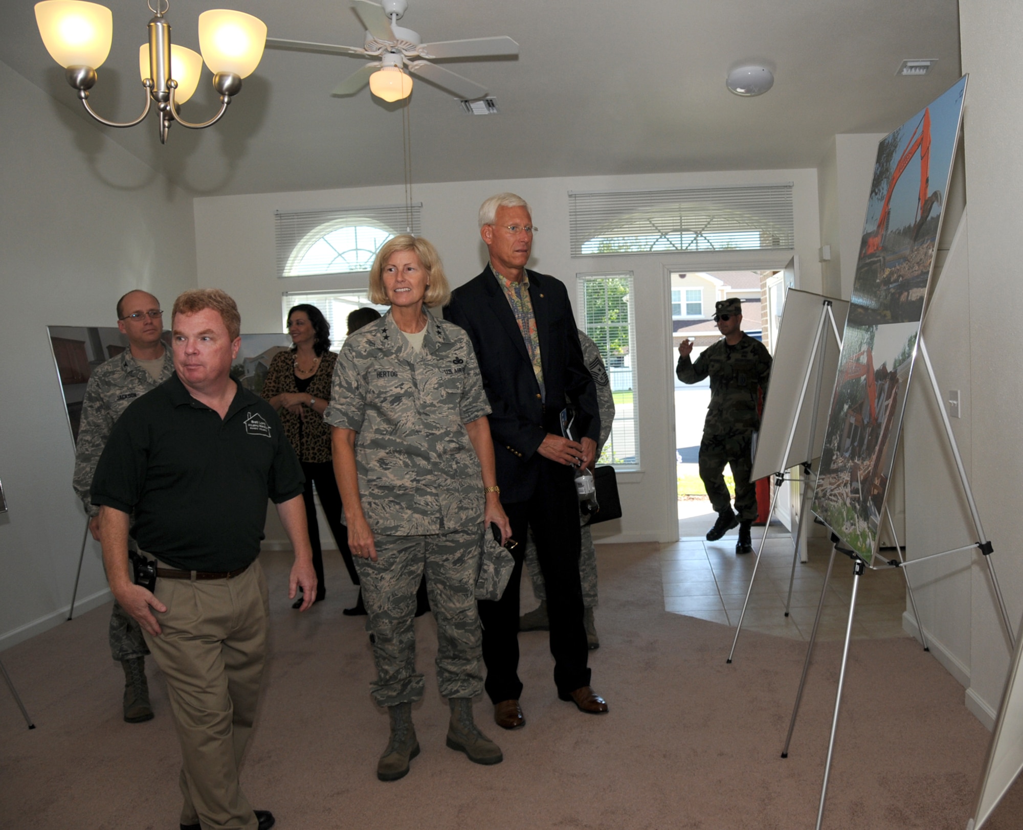 Brett Long, left, housing manager for the 81st Infrastructure Division, gives General Hertog and her husband, Herm, a tour of one of the new enlisted homes in East Falcon Park.  Mr. Hertog is a retired chief master sergeant.  (U.S. Air Force photo by Kemberly Groue)