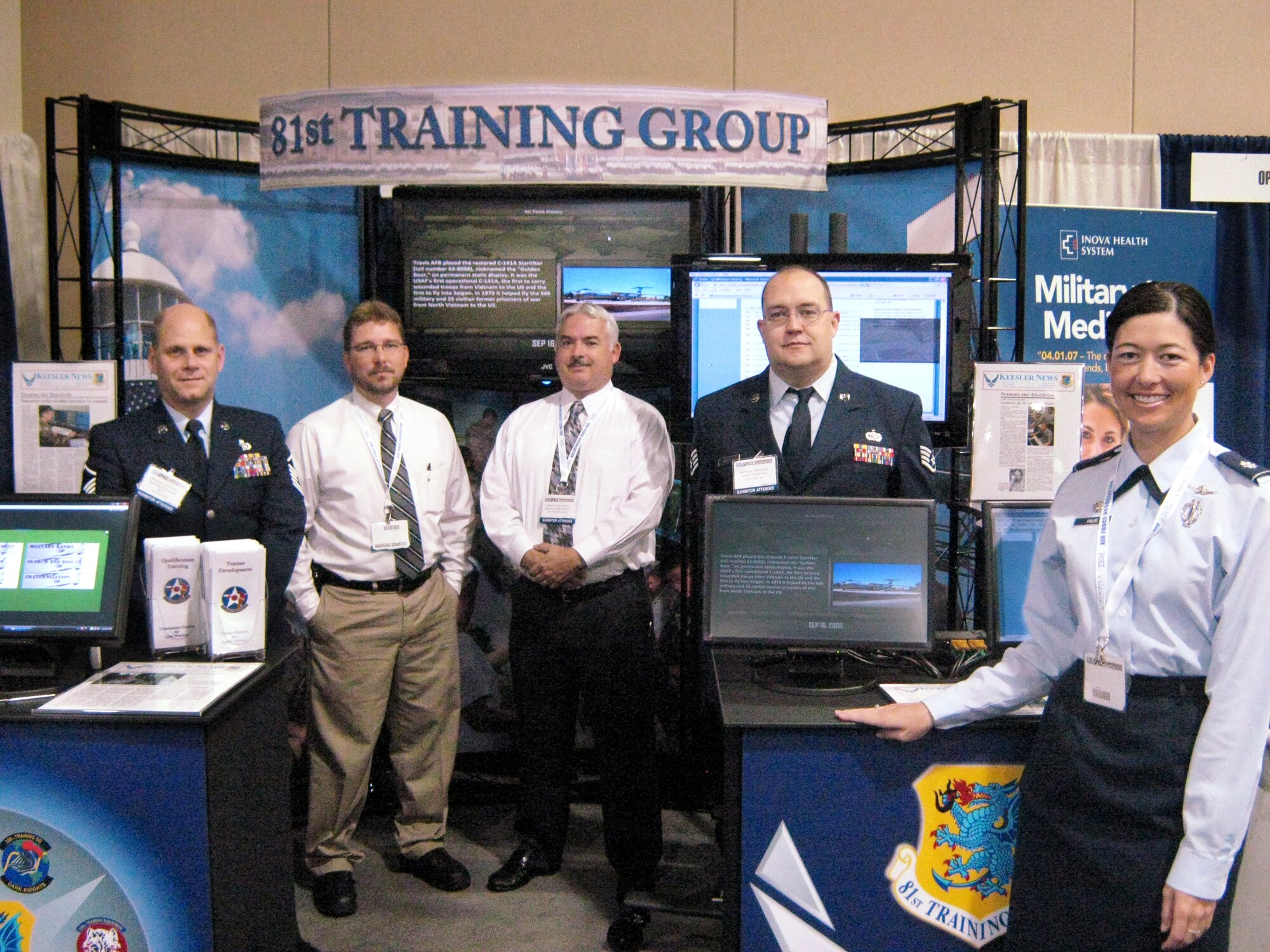 From left, Master Sgt. Michael Estensen, Rob Cowan, Jesse Cheeseman, Staff Sgt, Rand Bundenthal, and Lt. Col. Janet Haug, commander, from the 81st Training Support Squadron, were among the Keesler representatives at the Air Force Association’s 2009 national convention last month in National Harbor, Md.  The 81st Training Group’s display was one of more than 135 exhibits of the latest in aerospace and defense technology at the Air and Space Conference and Technology Exhibition 2009 that coincided with the AFA’s annual meeting.  (U.S. Air Force photo by Rob Cowan)