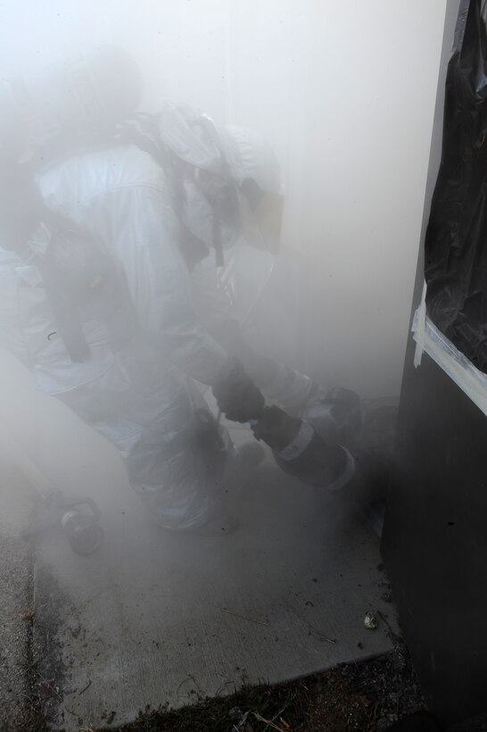 Airman 1st Class Cody Simpson, 28th Civil Engineer Squadron firefighter, drags Tech. Sgt. Jason Clark, 28th Medical Operations Squadron medical technician, from a simulated burning building during a Phase II Operational Readiness Exercise here, October 6. The exercise is in preparation of a Operational Readiness Inspection scheduled for next year. (U.S. Air Force photo/Senior Airman Kasey Zickmund)