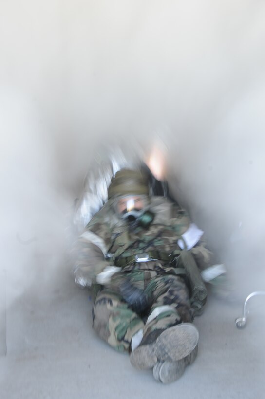Staff Sgt. Anthony White, 28th Civil Engineer Squadron firefighter, pulls Tech. Sgt. Weldon Lasseter, 28th Medical Operation Squadron NCO in charge of ambulance services, from a simulated burning building here, October 6.  Ellsworth Airmen undergo numerous training missions during a Phase II Operational Readiness Exercise. (U.S. Air Force photo/Airman 1st Class Anthony Sanchelli)