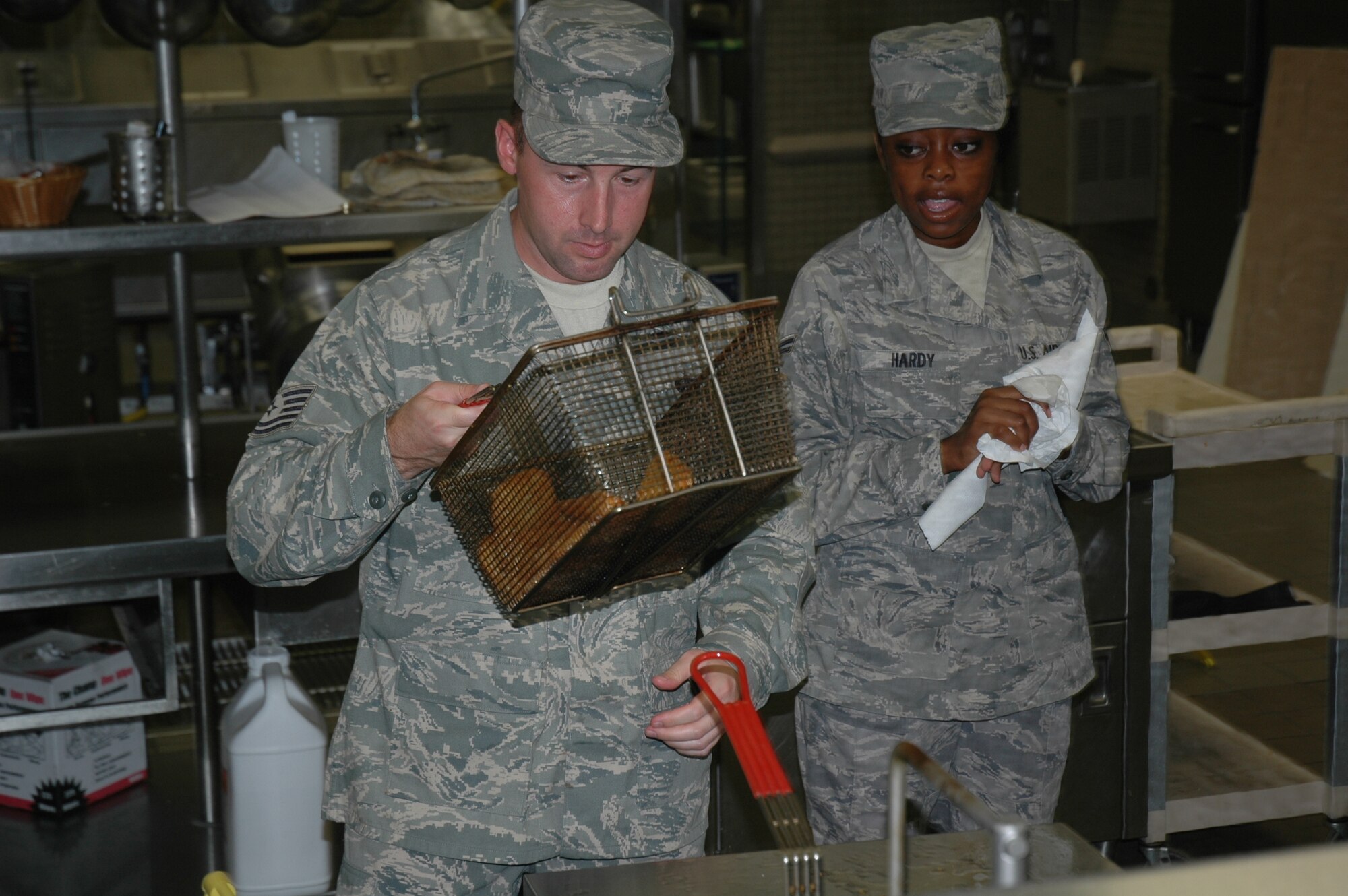 Staff Sergeant Jeffery Charvat of the 944th Services Flight cooks for airmen Sunday, Sept. 13, in the Ray V. Hensman Dining Facility, Luke Air Force Base. (U.S. Air Force photo/Senior Airman Andre Bowser)