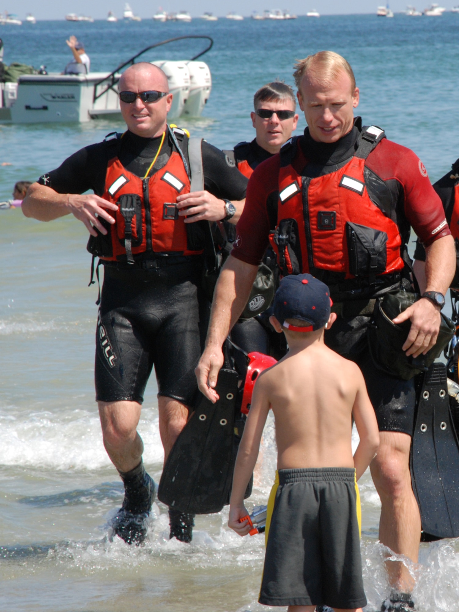 PATRICK AIR FORCE BASE, Fla. – A Cocoa Beach Air Show onlooker meets a 920th Rescue Wing reservist, Master Sgt. John Grant, Pararescueman, as he ascends onto the beach after his HH-60 Pave Hawk rescue demonstration Oct. 2-4, 2009. Known as “Citizen Airmen,” Air Force Reservists are dedicated, dual-hatted professionals who live in your neighborhood and work in your community. When called to duty, reservists put their civilian lives on hold to defend our nation. (U.S. Air Force photo by/Master Sgt. Bryan Ripple)