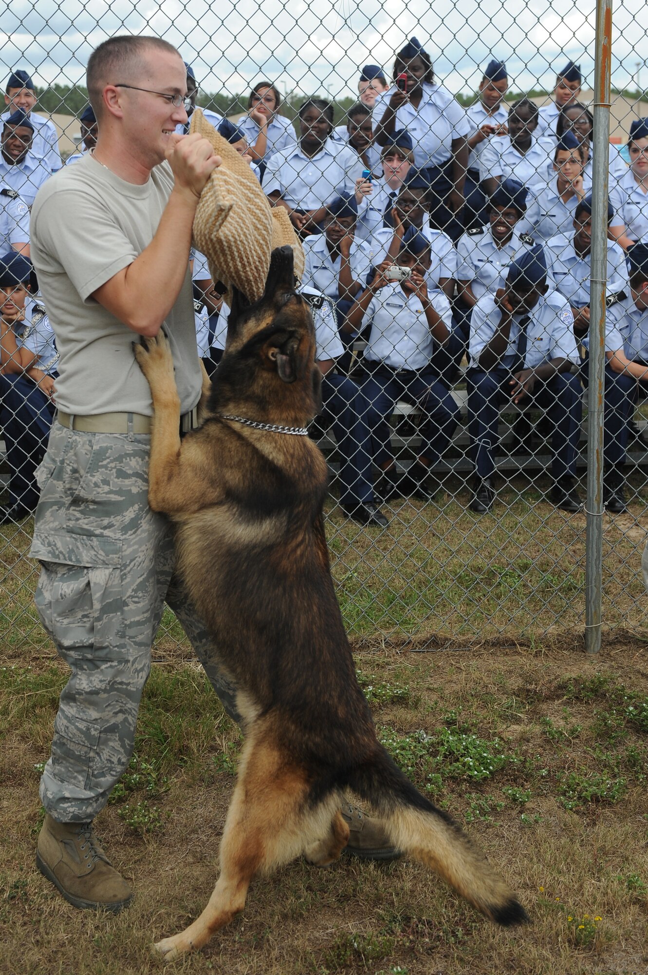 SHAW AIR FORCE BASE, S.C. -- 1Lt Joshua Miller, 20th Medical Group, demonstrates to Air Force Junior Reserve Officers Training Corps cadets how military working dogs stop a suspect Sept. 24. (U.S. Air Force photo/ Senior Airman David Minor)