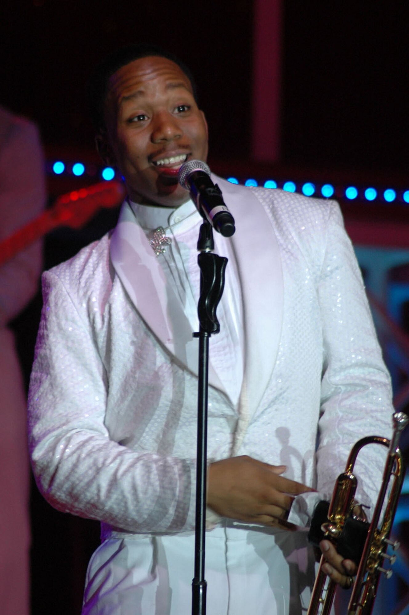 Airman 1st Class Anthoney Williams, 35th Civil Engineer Squadron, Misawa Air Base, Japan, sings and plays the trumpet during the Tops in Blue performance at Aviano Air Base, Italy, Oct. 3, 2009. Tops in Blue are a mixture of musically talented members of the Air Force from various Air Force specialties and come together each year to entertain Airmen and their families stationed worldwide.  (U.S. Air Force photo/ Staff Sgt. Mercedes Crossland)