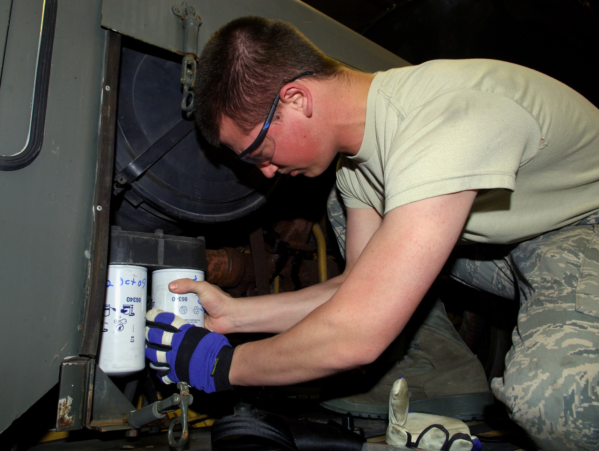 MINOT AIR FORCE BASE, N.D. -- Airman 1st Class Jason Stiles, 5th Logistics Readiness Squadron all-purpose vehicle maintenance apprentice, provides regular maintenance on the WT2206 Oshkosh snow plow here, Oct. 6. Maintenance on these vehicles is paramount to the safety the Airmen and the mission at Minot AFB. (U.S. Air Force photo by Senior Airman Michael Veloz)
