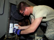 MINOT AIR FORCE BASE, N.D. -- Airman 1st Class Jason Stiles, 5th Logistics Readiness Squadron all-purpose vehicle maintenance apprentice, provides regular maintenance on the WT2206 Oshkosh snow plow here, Oct. 6. Maintenance on these vehicles is paramount to the safety the Airmen and the mission at Minot AFB. (U.S. Air Force photo by Senior Airman Michael Veloz)