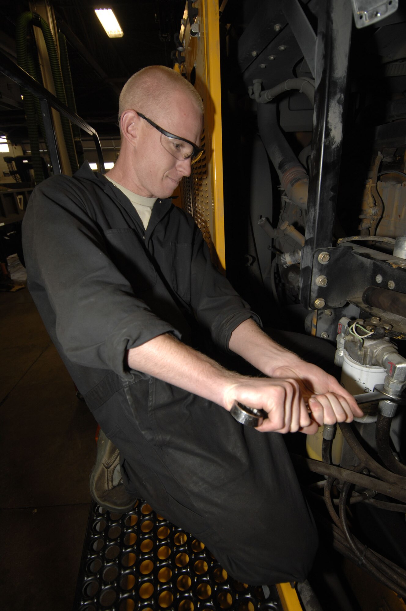 MINOT AIR FORCE BASE, N.D. – Airman 1st Class Tommy Yost, 5th Logistics Readiness Squadron all-purpose vehicle maintenance apprentice, replaces a hydraulic line on an Oshkosh Sweeper, here. Oct. 6. Airman Yost is doing routine maintenance in preparation for the upcoming winter weather. (U.S. Air Force photo by Senior Airman Matthew Smith)
