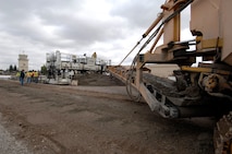 MINOT AIR FORCE BASE, N.D. –- A concrete placer deposits concrete for a slipform paver here, Oct. 6.  Construction work like this is one of the many improvements planned for Minot AFB. (U.S. Air Force photo by Senior Airman Matthew Smith)